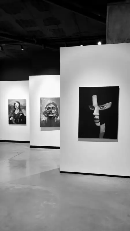 Art gallery interior with portraits on the wall, black and white