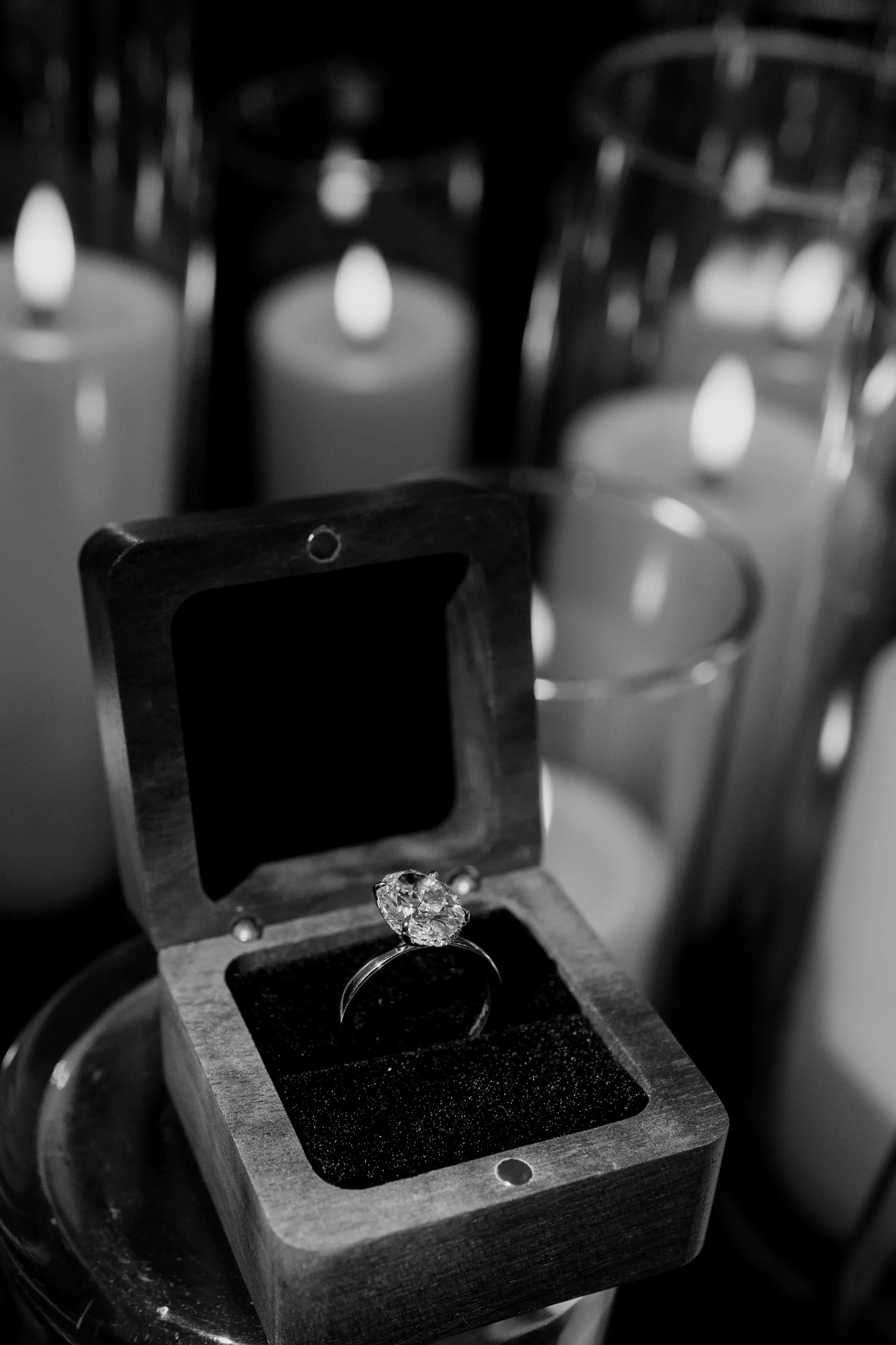 The engagement ring in its box, close-up, black and white